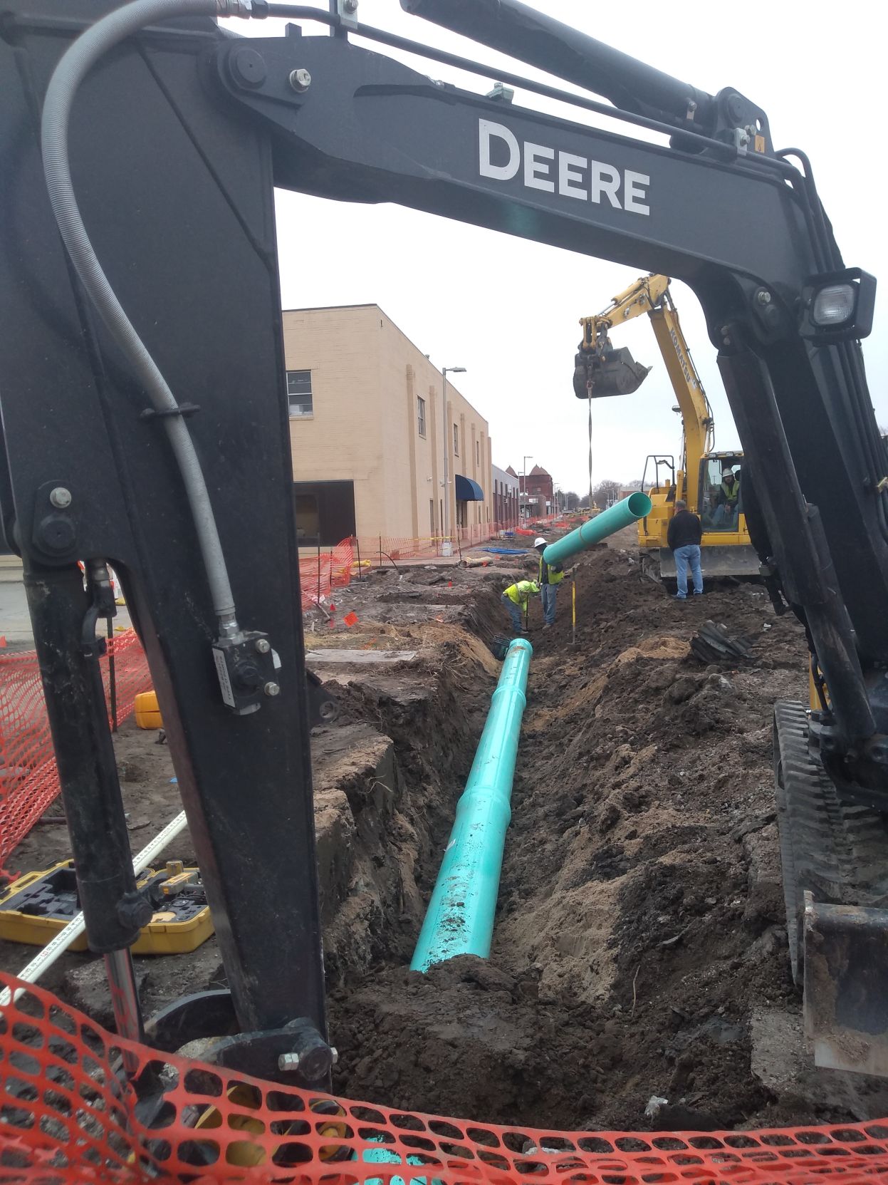 Construction crews install new storm sewer mains on ‘bricks’